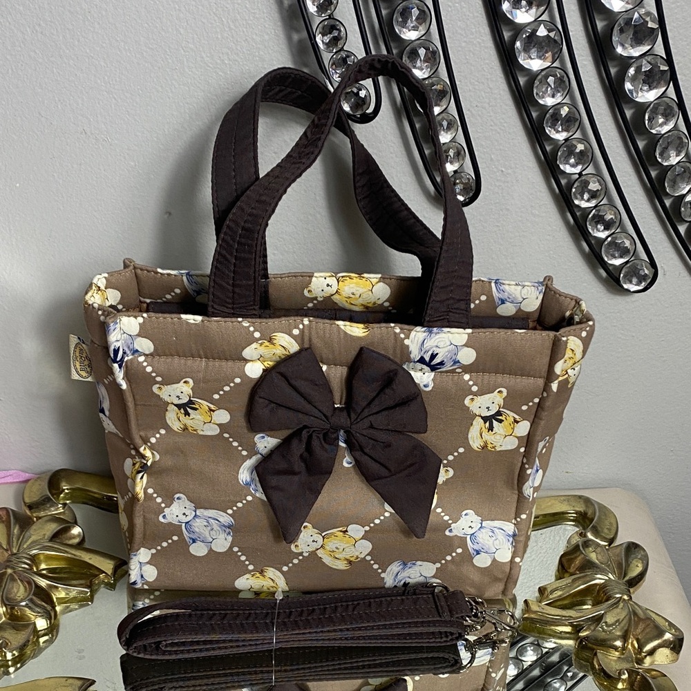 NaRaYa cotton handbag with a brown bear print and a front bow